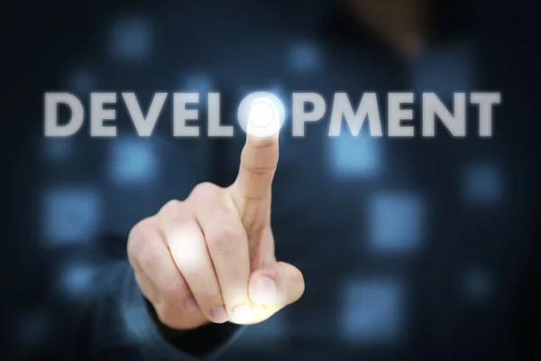 Businessman hand touching Development