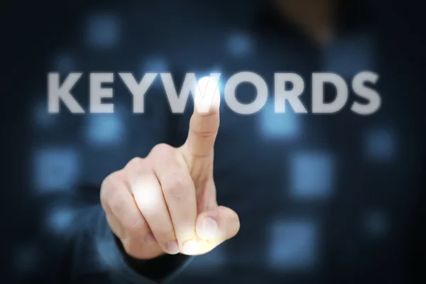 Businessman  hand touching Keywords — Stock Photo, Image