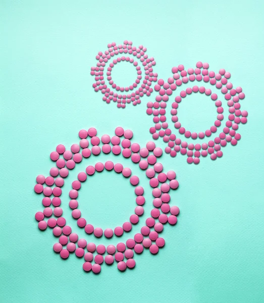 Stimulation. Creative medicine and healthcare concept made of drugs and pills, in the shape of gears.