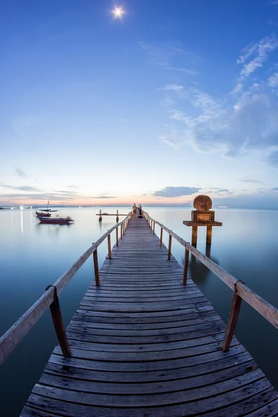 Wooden bridge and a hut sunrise by the shore of George Town, Penang Malaysia Stock Photo