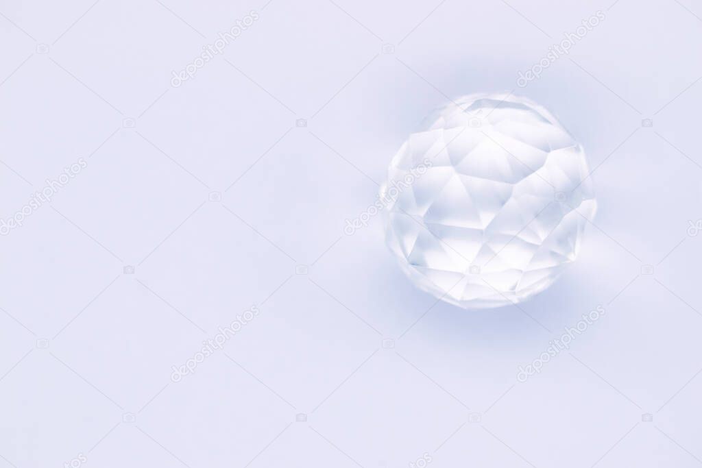Faceted sphere, sparkling crystal on white background. Glass object with light refraction, empty space for inscriptions. Illustration
