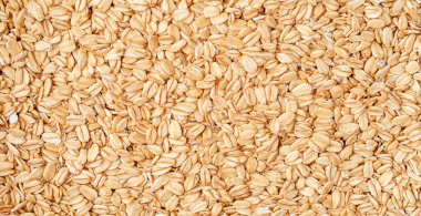 Çiğ yulaf arka planı. Sağlıklı yiyecekler, tepeden bakıldığında.