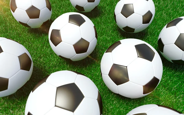 Soccer balls on the grass. — Stock Photo, Image