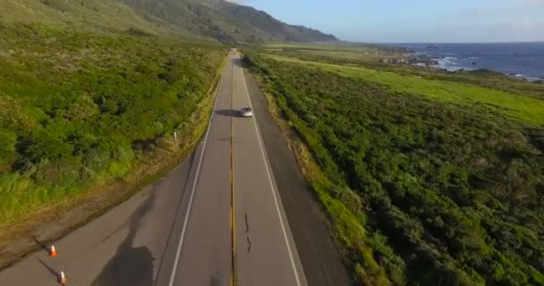 Cars drive on road along the Big Sur — Stock Video