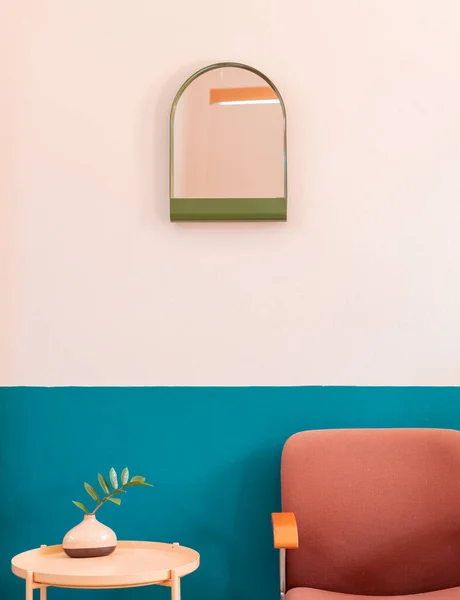 Creative colourful retro living room cornor with wooden table, chair furniture and mirror, retro pastel interior design