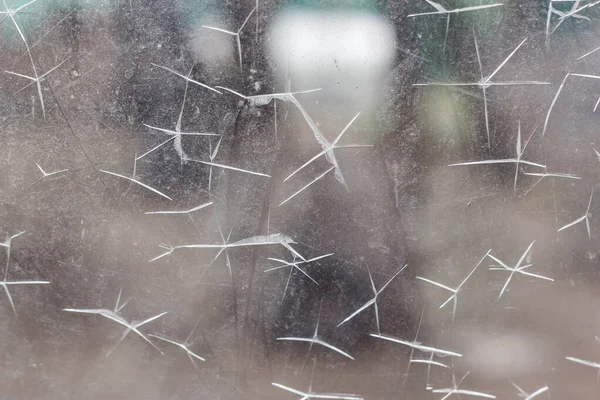 Close Dirty Scratched Glass Window Damage Plastic Bullet Hits Gun — Stock fotografie