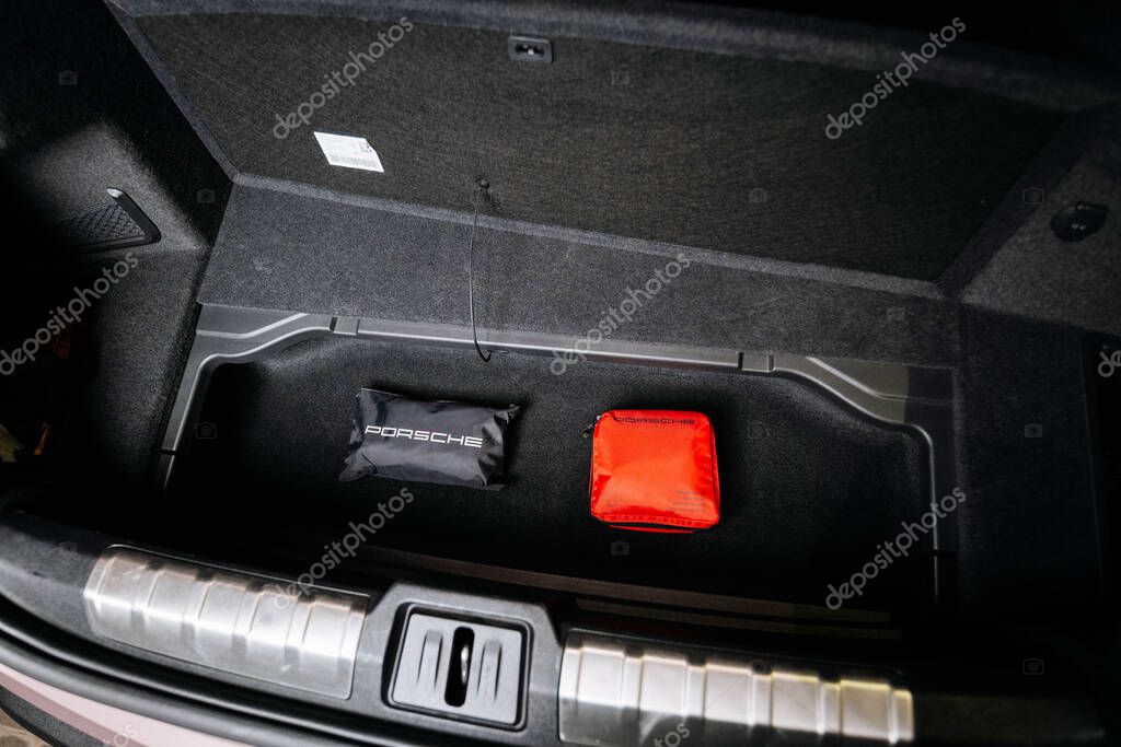 Vinnitsya, Ukraine - 15 of July 2025: open Porsche trunk with branded safety kits displayed. High quality photo