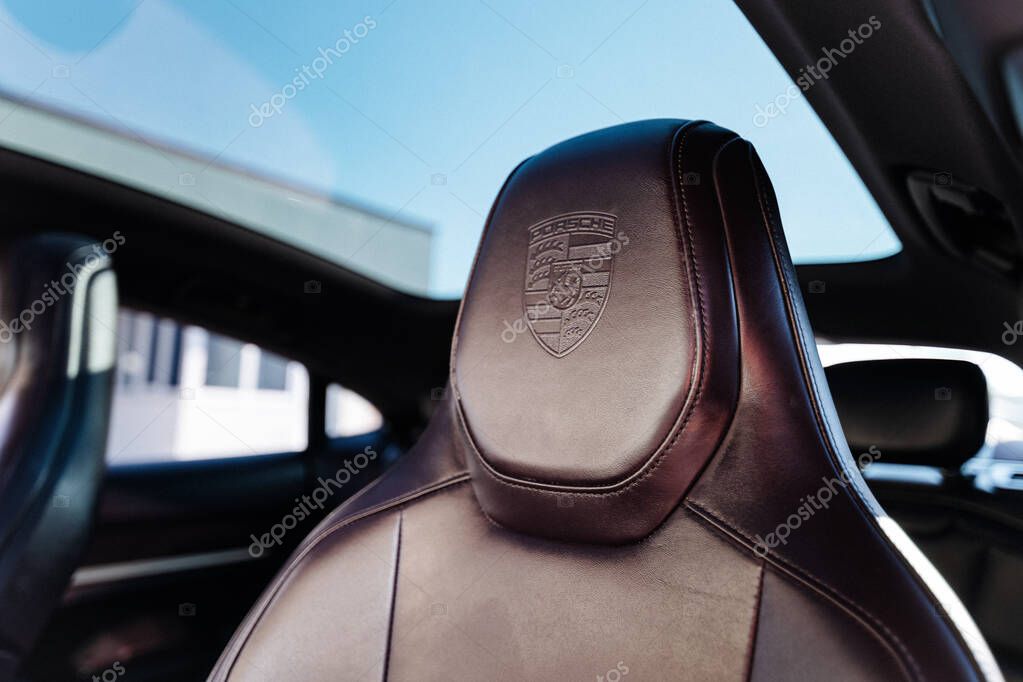 Vinnitsya, Ukraine - 15 of July 2025: closeup of luxury car seat with embossed Porsche logo. High quality photo