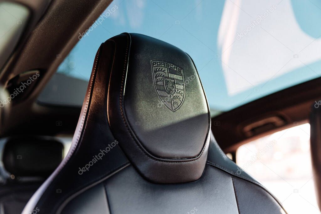 Vinnitsya, Ukraine - 15 of July 2025: closeup of luxury car seat with embossed Porsche logo. High quality photo