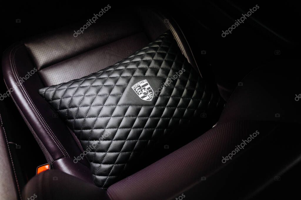 Vinnitsya, Ukraine - 15 July 2025: leather Porsche cushion on seat of luxury electric sports sedan. High quality photo