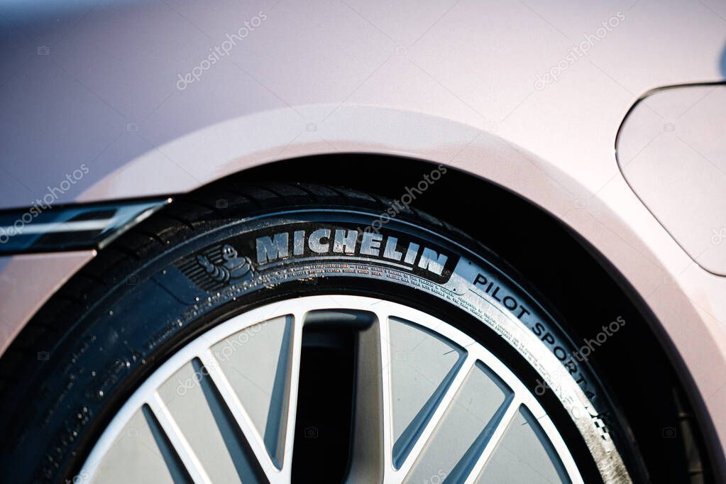 Vinnitsya, Ukraine - 15 of July 2025: Close up Michelin Pilot Sport tire on Porsche Taycan wheel. High quality photo