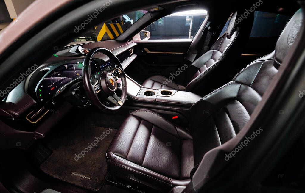 Vinnitsya, Ukraine - 15 of July 2025: Porsche Taycan luxury cockpit with leather seats and screens. High quality photo