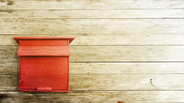 Red postbox on the wood background — Stock Photo, Image