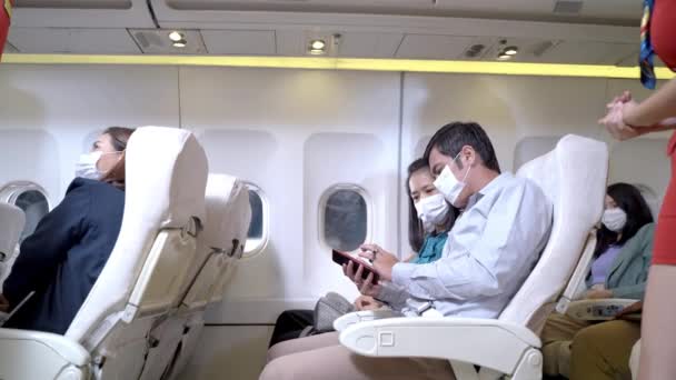 Passengers Sitting Using Smartphone Airplane Seats Air Hostess Walking Checking — Stock Video