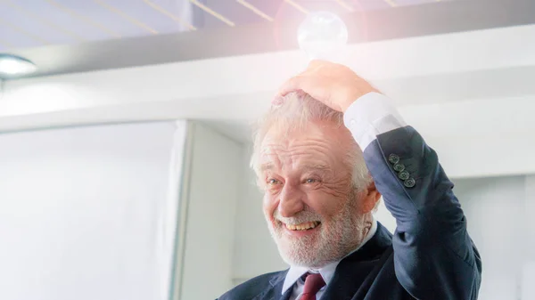 Close Face Senior Businessman Holding Light Bulb Idea Innovation Inspiration —  Fotos de Stock