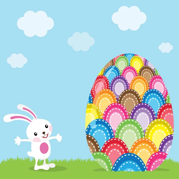 Пасхальный кролик и красочное окрашенное яйцо — стоковый вектор