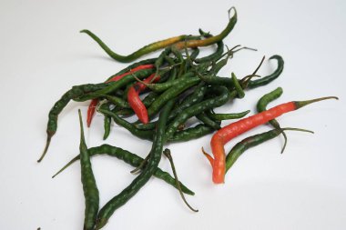 green chili on white background