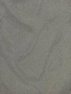İnce gri kumların büyüleyici doğal dokusu, yaratıcı projeler ve tasarımlar için çok yönlü, minimalist bir zemin sunuyor..