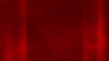 Dinamik ve soyut bir video klipte yumuşak bir kırmızı renk akışı