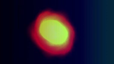 Karanlık uzayda canlı sarı ve kırmızı ışık patlaması