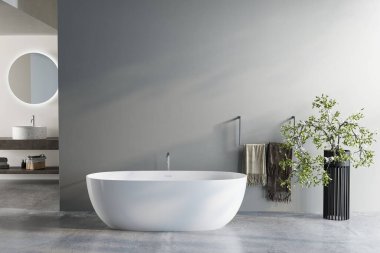 Modern banyo içi serbest beyaz banyo küveti, dekoratif ev bitkisi ve rafta havlular, 3D işlemeli.