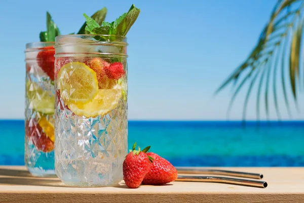 Hard seltzer cocktails on summer beach.