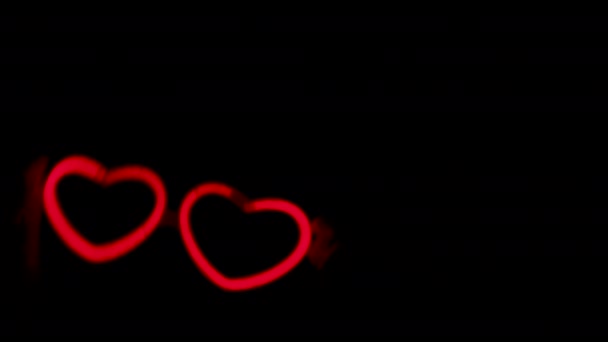 Red neon hearts on black background. Two neon hearts dancing together. —  Stock Video © Ukrolenochka #443353952