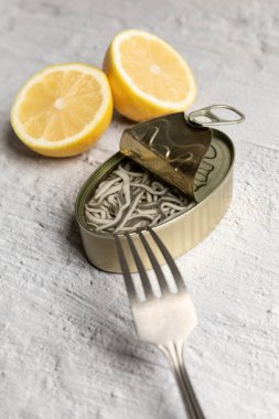 Canned elvers isolated on kitchen countertop. High quality photo