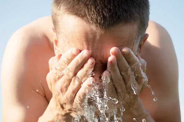 Young White Man Washing His Face Water Stock Photo