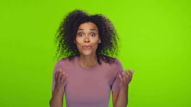 African optimistic woman raises palms from joy happy to receive awesome present — Stock Video