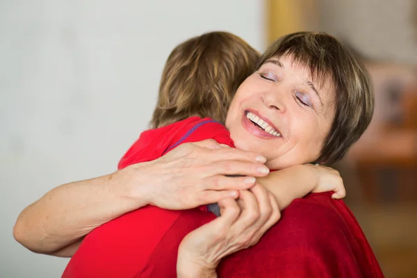 Lovely little boy with his grandmother having fun and happy moments together at home — Stock Photo, Image