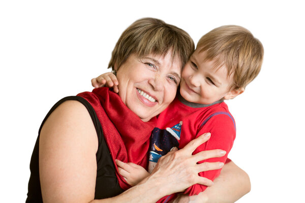 Lovely little boy with his grandmother having fun and happy moments together at home