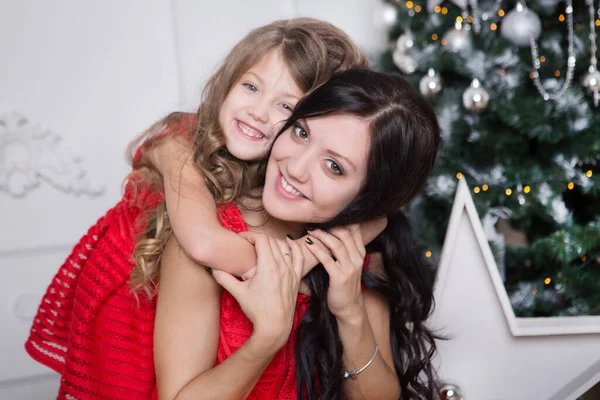 Mother Happy Little Daughter Red Dresses Hugging New Year Tree — Stock Photo, Image