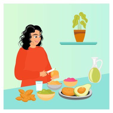 Meyve diyeti konsepti. Kırmızı kazaklı bir kadın, meyve, badem ve avokado kâseleriyle çevriliyken bir portakalı dilimliyor..