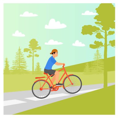 Bisiklet pisti konsepti. Yeşil ağaçlarla çevrili bisiklet yolunda bisiklet süren genç bir adam, pedal çevirirken sessizce bisiklet sürmekten hoşlanır..