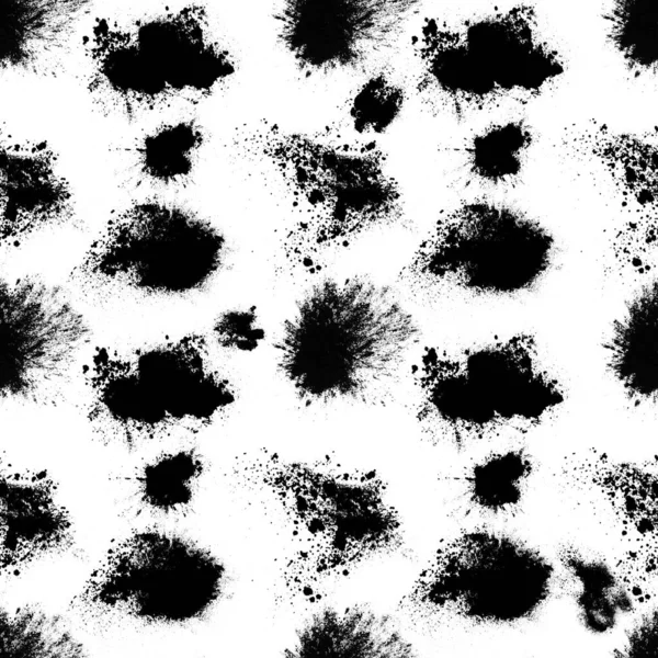 seamless pattern of black spots with splashes isolated on white