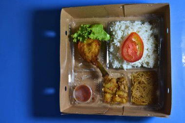 fried rice with chicken and vegetables in box