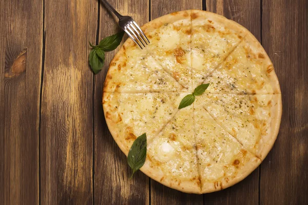 Four cheese pizza with basil and oregano — Stock Image Four cheese pizza with basil and oregano Stock Photo