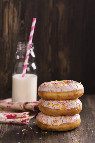 Homemade donuts and bottle of milk