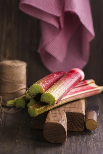 Fresh rhubarb on cutting board — Stock Photo, Image