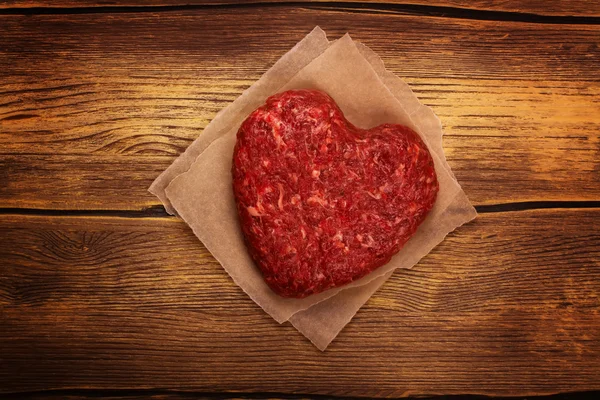 Raw heart shaped burger cutlet — Stock Photo, Image
