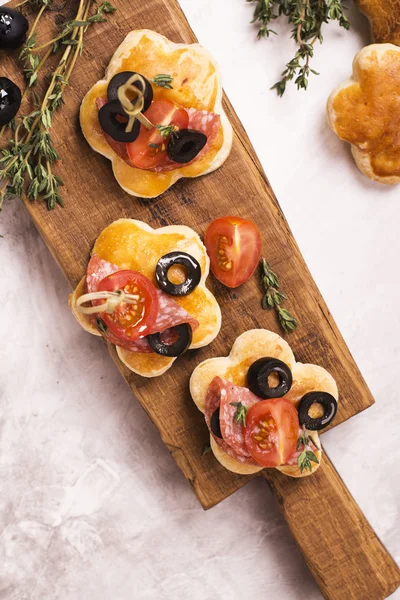 Tasty breakfast toasts on wooden board — Stock Photo, Image