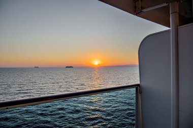 Beautiful orange sunrise sky over the sea horizon. Summer golden hour.