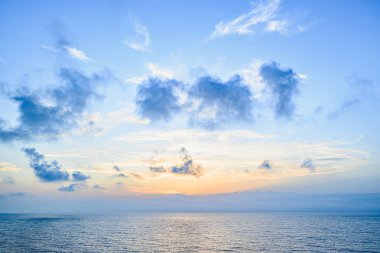 Beautiful orange sunrise sky over the sea horizon. Summer golden hour.