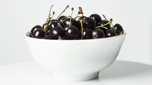 Cherries in white bowl. rotating. Still life. — Stock Video
