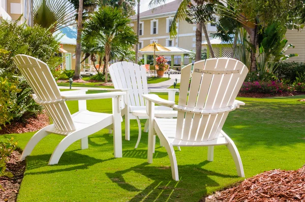 White Adirondack Chairs in a Garden — Stock Photo, Image