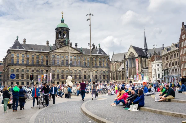People in Dam Square on a cloudy Afternoon