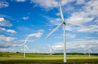 Tall Wind Turbines and Blue Sky clipart
