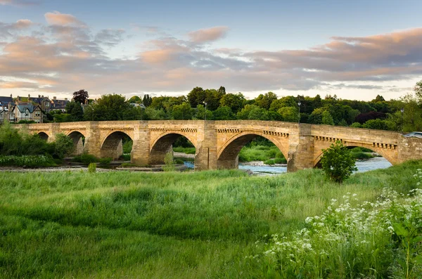 Arch bron vid solnedgången — Stockfoto