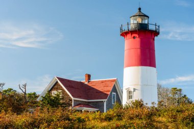  Historic Nauset Lighthouse at sunset in autumn. Cape Cod, MA, USA. clipart